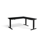 Lavoro Advance Corner triple-motor standing desk, black frame and black desktop; pictured size representative