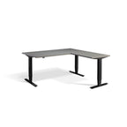 Lavoro Advance Corner triple-motor standing desk, black frame and graphite desktop; pictured size representative