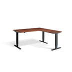 Lavoro Advance Corner triple-motor standing desk, black frame and natural dijon walnut desktop; pictured size representative