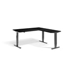 Lavoro Advance Corner triple-motor standing desk, dark grey frame and black desktop; pictured size representative