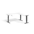 Lavoro Advance Corner triple-motor standing desk, dark grey frame and white desktop; pictured size representative