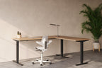 Lavoro Advance Corner height-adjustable desk in styled workspace, lifestyle view 6