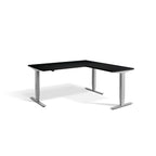 Lavoro Advance Corner triple-motor standing desk, silver frame and black desktop; pictured size representative