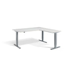 Lavoro Advance Corner triple-motor standing desk, silver frame and light grey desktop; pictured size representative