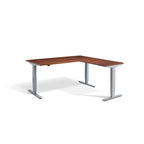Lavoro Advance Corner triple-motor standing desk, silver frame and natural dijon walnut desktop; pictured size representative