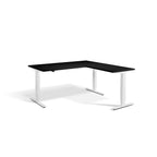 Lavoro Advance Corner triple-motor standing desk, white frame and black desktop; pictured size representative