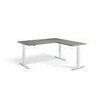 Lavoro Advance Corner triple-motor standing desk, white frame and graphite desktop; pictured size representative